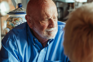 man in painful conversation